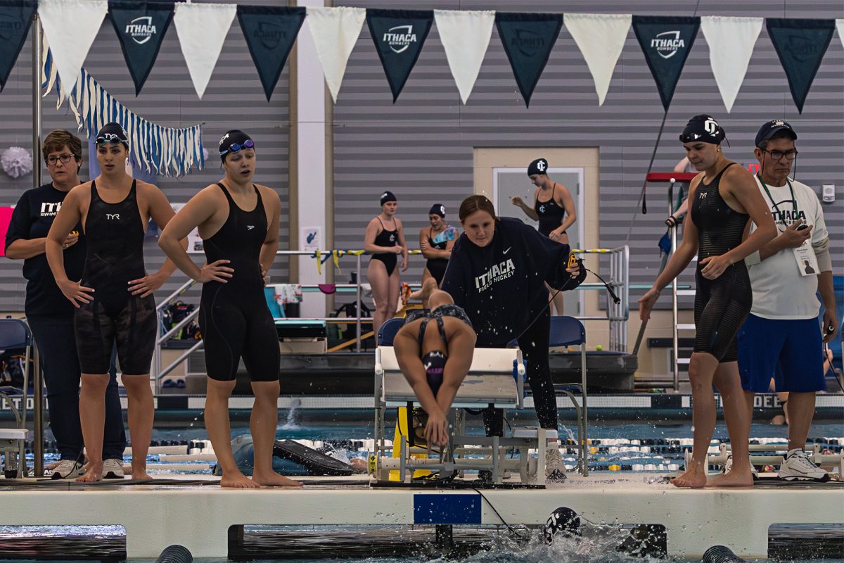 The women’s swim team supports their fellow teammate beginning a race. A key to the Bombers’ success has been their team chemistry and culture, keeping them fueled during a long, challenging season.