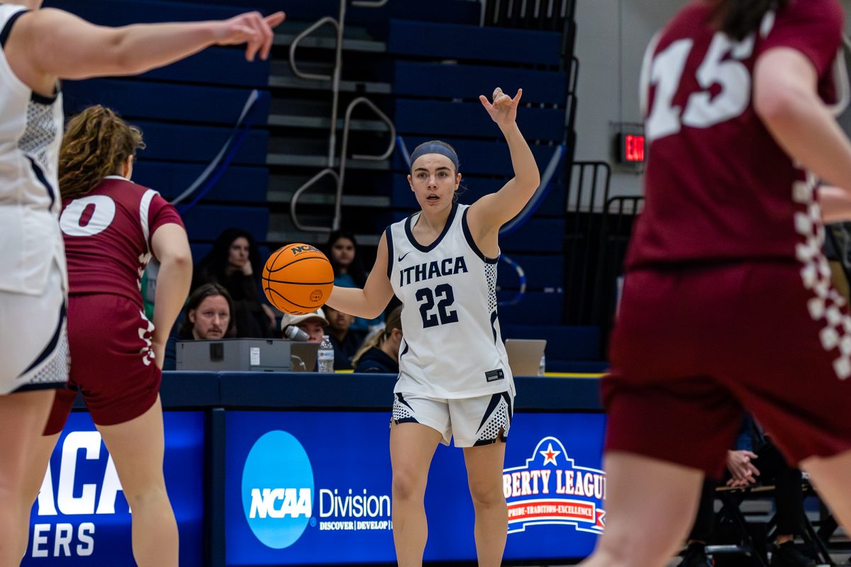 Sophomore guard Natalie Tucker directs the offense of her team in the 50-43 loss on senior day against Vassar College on Feb. 21 in Ben Light Gymnasium. The Bombers held the ball on offense for a majority of the game, which led to shot clock mistakes and team fatigue.