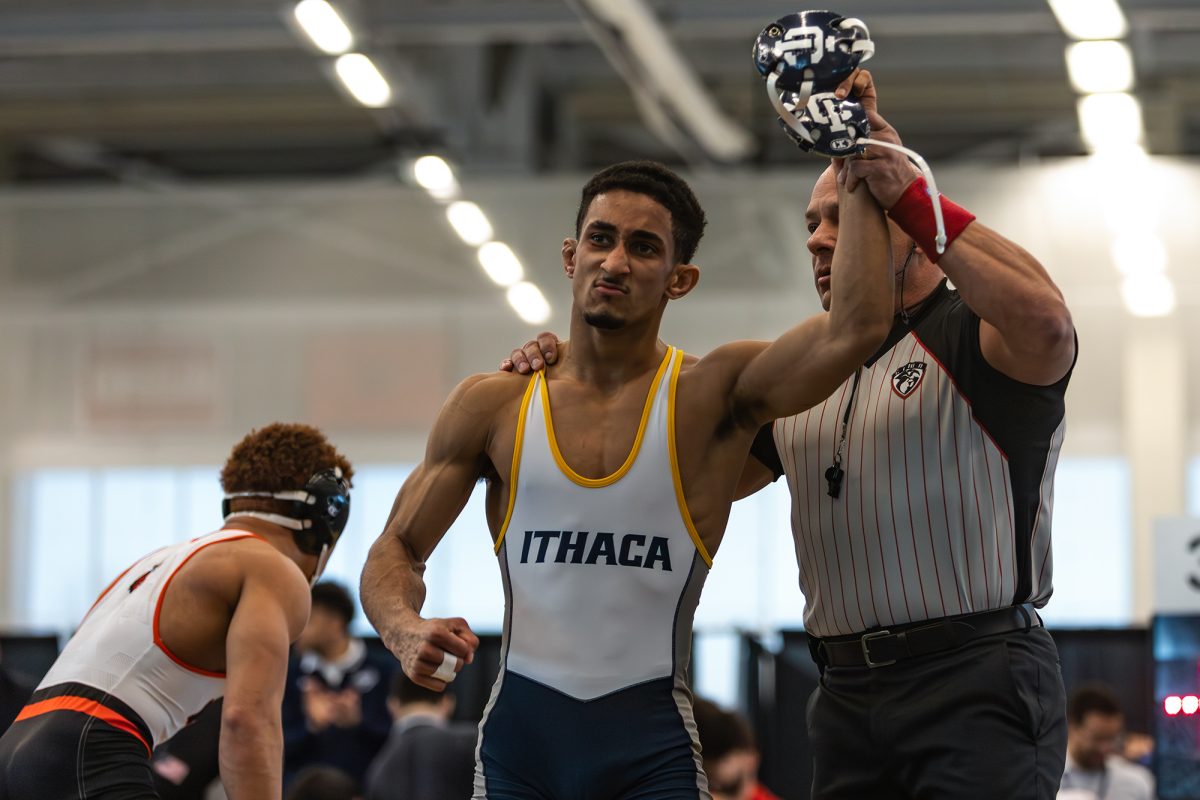 Senior Isaias Torres gets declared the winner of a match at the NCAA Regionals Feb. 28 in Glazer Arena. Torres will be one of the five IC wrestlers represented at the NCAA Division III Championship March 13. and 14 in Cedar Rapids, Iowa. 