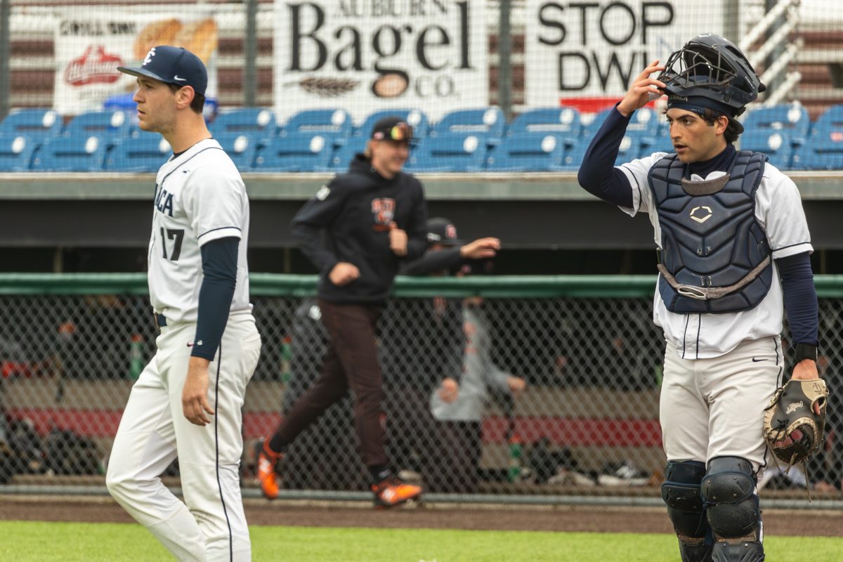 From left, junior pitcher Danny Drotos and senior catcher Ethan Daddabbo after the Rochester Institute of Technology takes a 12-11 lead in the ninth inning of game two in an eventual 12-11 RIT win. The Ithaca College baseball team allowed 35 runs over three games, the most it has ever allowed in a series.