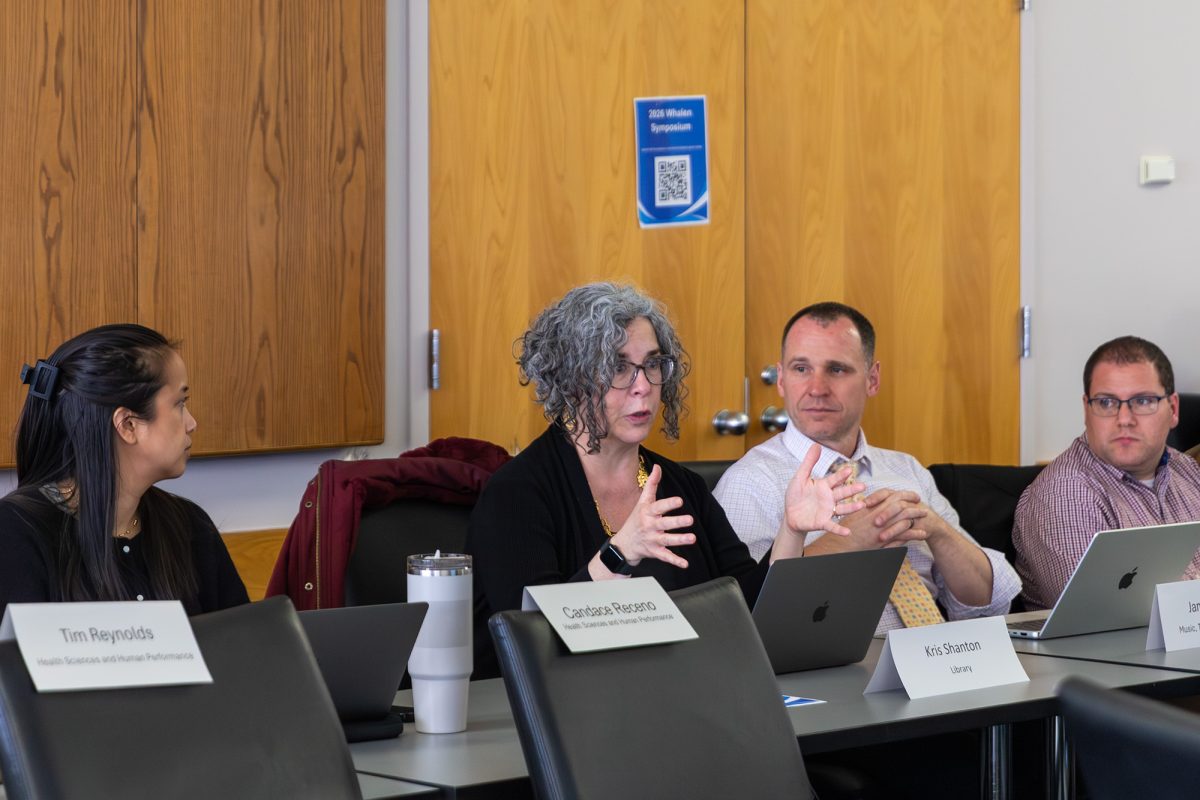 Kristina Shanton, music librarian at Ithaca College, engaging in discussion at the April 7 Faculty Council meeting.