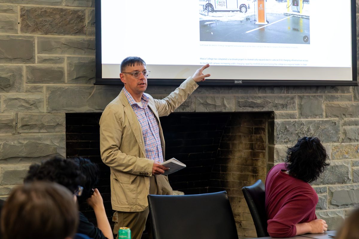 Scott Doyle ’98, the director of energy management and sustainability, presents to the Ithaca College Student Governance Council about recent sustainability initiatives and achievements.