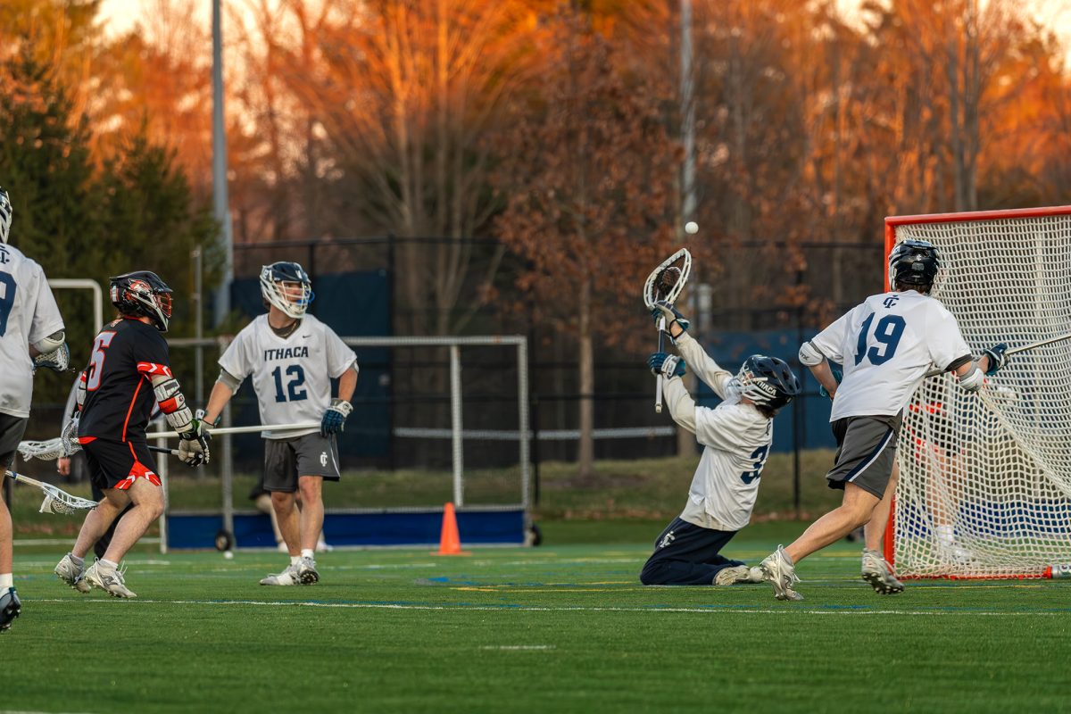 Senior goalkeeper Andrew Minard makes a highlight save in the 9-8 win against No. 6 ranked Rochester Institute of Technology April 8 at Higgins Stadium. Minard contributed to the upset with 13 saves, one of his best performances of the season. 
